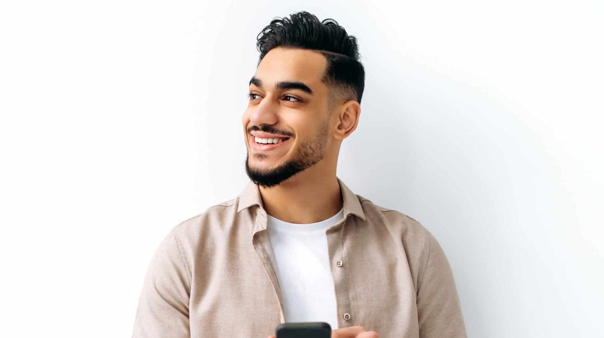 Confident,Positive,Handsome,Indian,Or,Arabian,Young,Man,,Holding,Smartphone